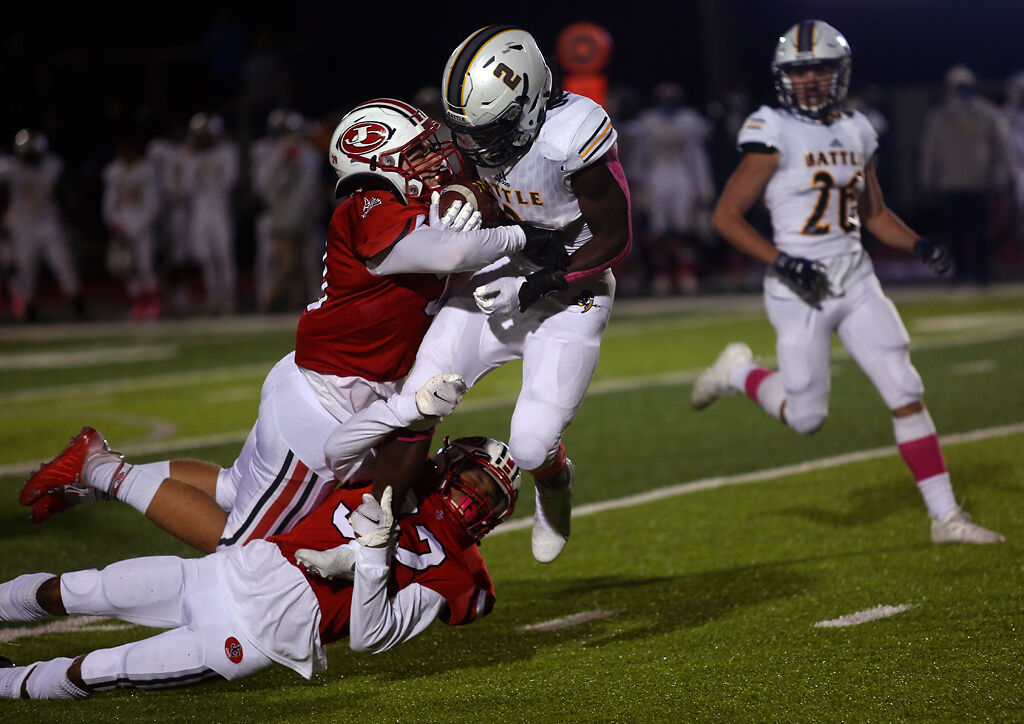 Battle junior Gerry Marteen is tackled by Jefferson City senior Josh Copeland